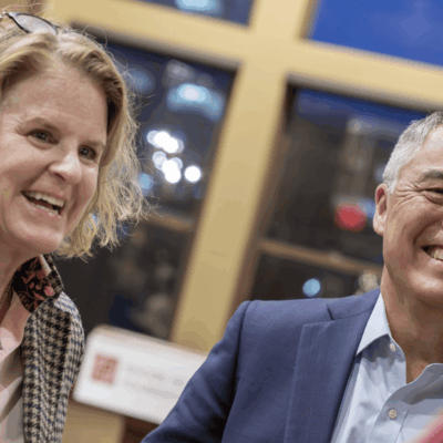 A man and woman smiling for the camera.