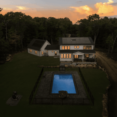 A house with a pool in the middle of it