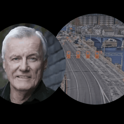 A man with a beard and mustache next to an image of a train track.