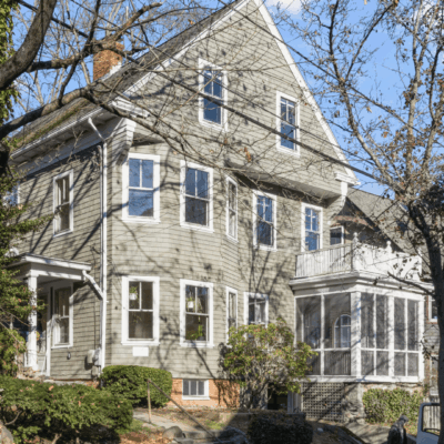 A large house with many windows and trees