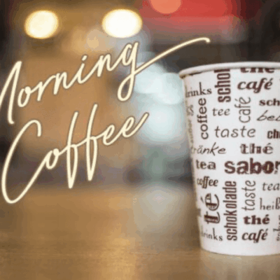 A coffee cup sitting on top of a table.