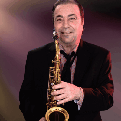 A man holding a saxophone in his hands.