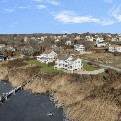 A bird 's eye view of houses and water.