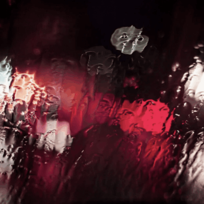 A blurry image of the rain on a window.