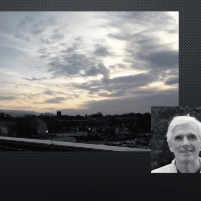 Sunset sky and grayscale portrait of man.