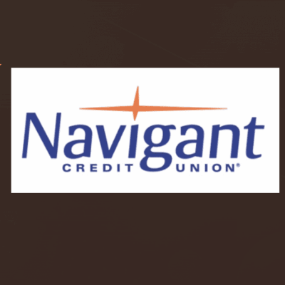 A navigant credit union logo on top of a brown background.