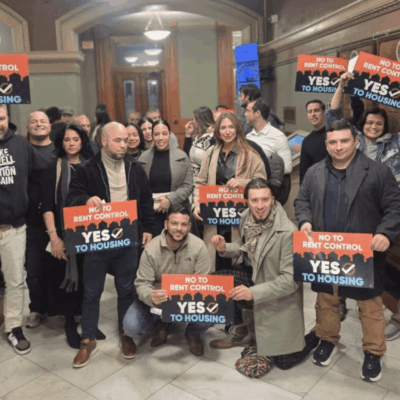 Group holding signs advocating for the Reproductive Health Act.