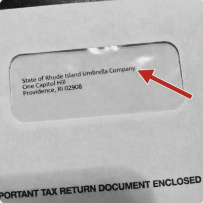 Close-up of a mailing envelope with tax return documents.
