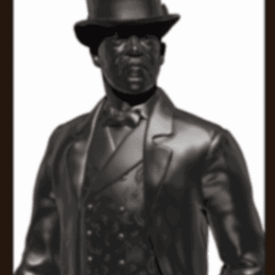A black statue of a man wearing a hat and suit.