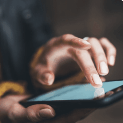 Person interacting with a smartphone touchscreen.
