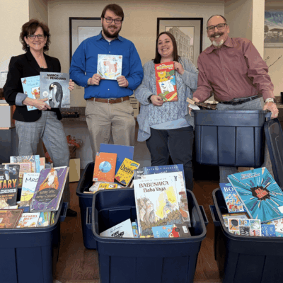 Book donation for Books are Wings - Beacon Bank