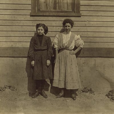 Two Portuguese girls working in Royal Mill, River Point, R.I. Younger girl, Mary Fartado "Works on lace." Been in mill 3 years. Other girl 3 years too. they do not speak English. Location: River Point, Rhode Island.