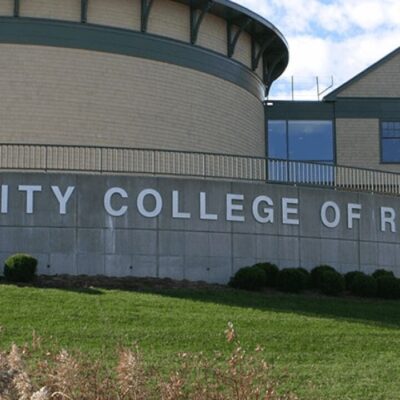 Building exterior of a community college with clear signage.