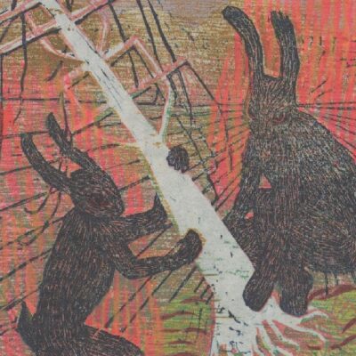 Two rabbits fighting by a tree.