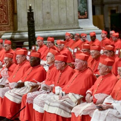 Group of cardinals seated in a church.
