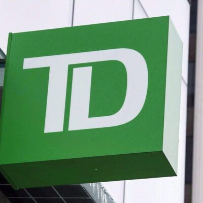 A green td sign is on the side of a building.