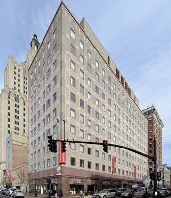 A large building on the corner of a street.