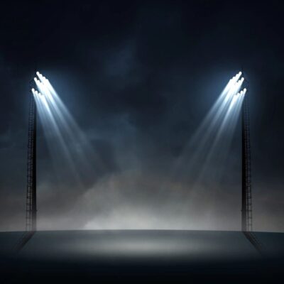 Two spotlights on a dark background.