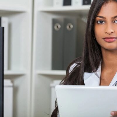 Female doctor using tablet in office.