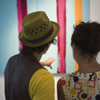 A man wearing a hat and a woman wearing a hat.