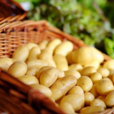 Basket of fresh yellow potatoes.