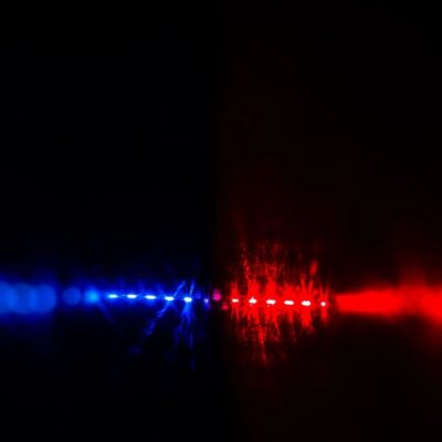 A blue and red light in the dark.