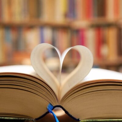 A book with an open heart shaped page.