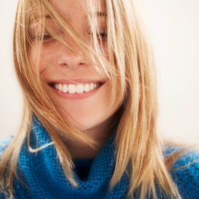 A woman with blonde hair smiling for the camera.