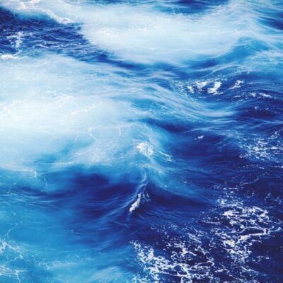 A close up image of blue water in the ocean.