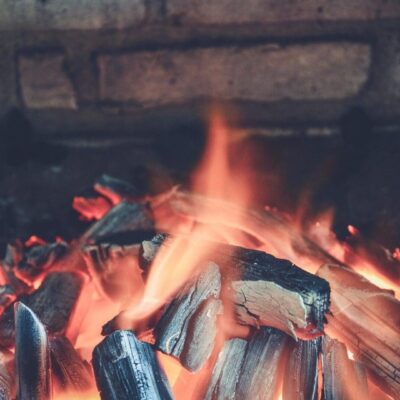 A close up image of a fire in a fireplace.