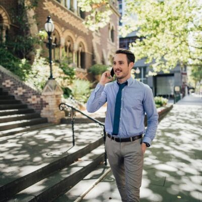 Man in business attire on phone call.