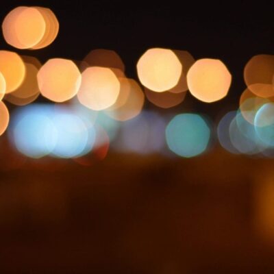 Abstract bokeh lights in warm and cool tones.
