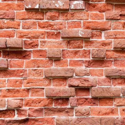 A close up of a red brick wall.