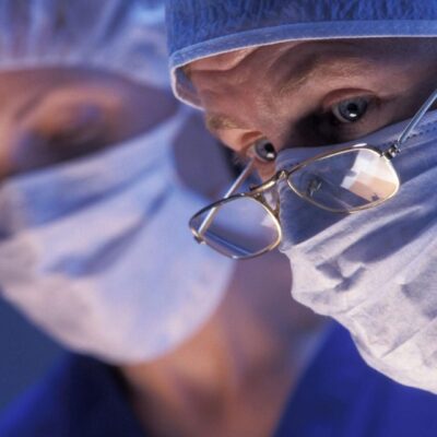 Surgeons focused during a complex operation in a sterile environment.