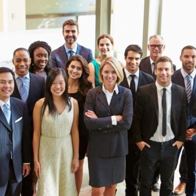 A group of business people posing for a photo.