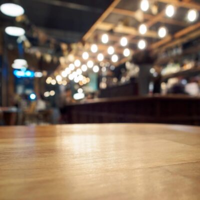 An empty wooden table in a restaurant.