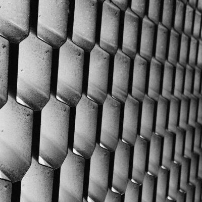 Black and white hexagonal metal grid.