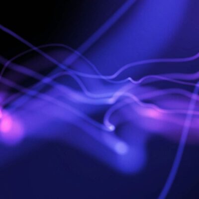 A purple and blue wave pattern on a black background.