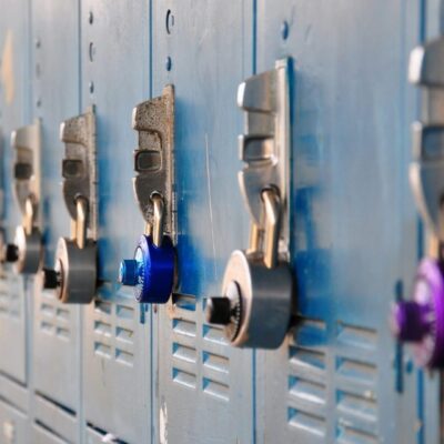 A row of lockers with different colored locks.