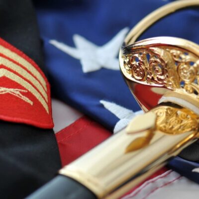 A sword on top of an american flag.