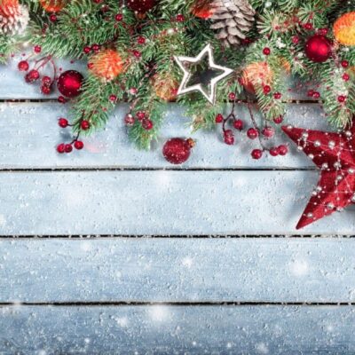 A wooden table with christmas decorations on it.