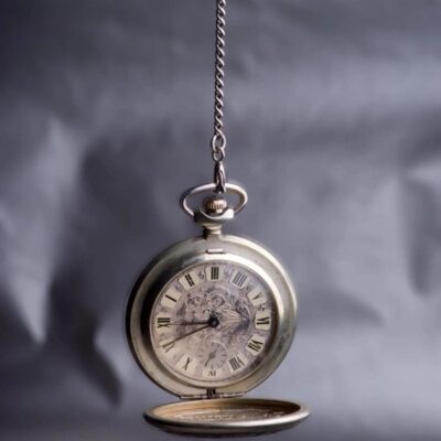 Antique pocket watch on chain.