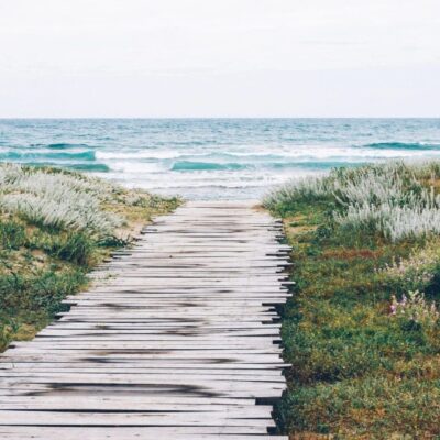 Wooden path to a serene beach.