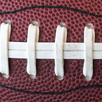 A close up of the laces on a football