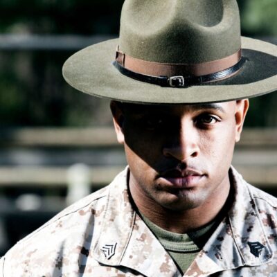 A man in a military uniform wearing a hat.