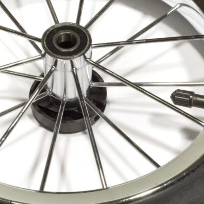 A close up of a bicycle wheel with a spoke.