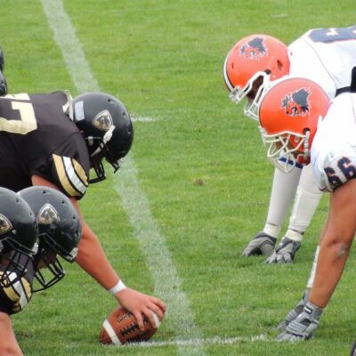 A group of football players lined up for a game.