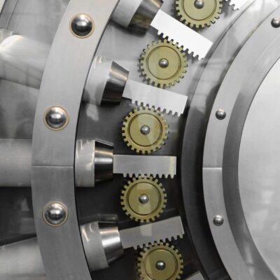 A close up of a bank vault with gears and gears.