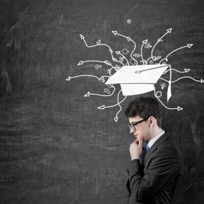 Man contemplating career paths after graduation.