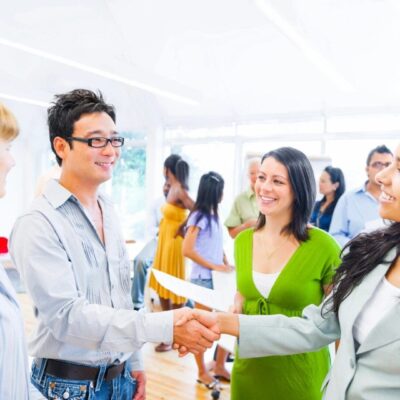 Business people shaking hands in office.